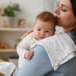 Mother holding baby upright after feeding to help reduce infant reflux and spit-up naturally.